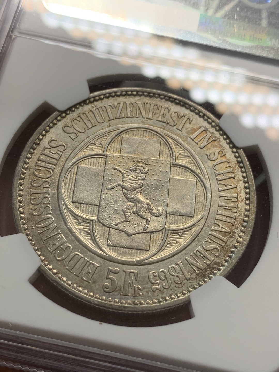 《竞宝斋》第85场-本周日，周一2场连拍（全场不限金额包邮） NGC-UNCD 瑞士 1865年 5法郎 沙夫豪森射击节银币 紫罗兰包浆