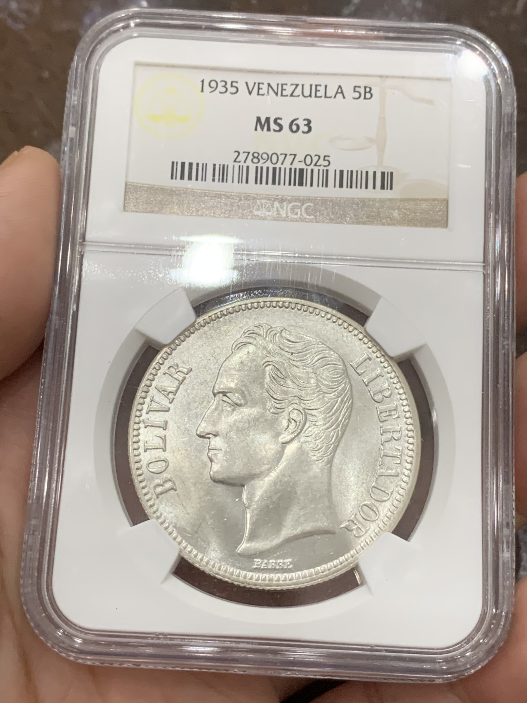 《竞宝斋》第85场-本周日，周一2场连拍（全场不限金额包邮） NGC-MS63 委内瑞拉1935年 5波利瓦大银币 车轮转光 这品种平时多见就是VF-XF ，这品相已经顶级