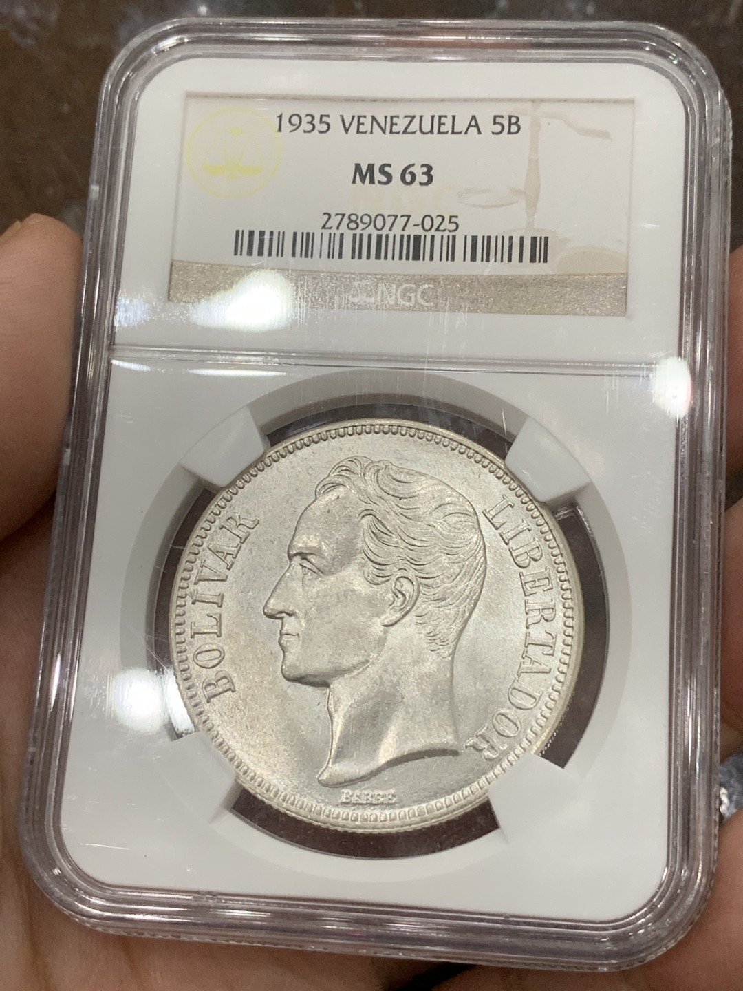 《竞宝斋》第85场-本周日，周一2场连拍（全场不限金额包邮） NGC-MS63 委内瑞拉1935年 5波利瓦大银币 车轮转光 这品种平时多见就是VF-XF ，这品相已经顶级