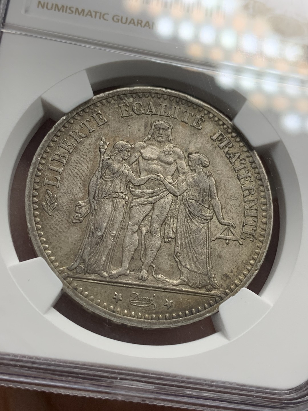 《竞宝斋》第85场-本周日，周一2场连拍（全场不限金额包邮） NGC-AU58 法国1875-A年 大A版 大力神5法郎银币 原味好品 年份也不错