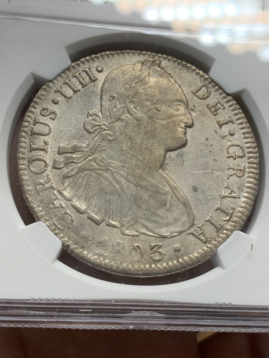 《竞宝斋》第91场-本周日，周一2场连拍（全场不限金额包邮） NGC AU 墨西哥 1803年 卡四 8R 双柱 大银币 打制的不错