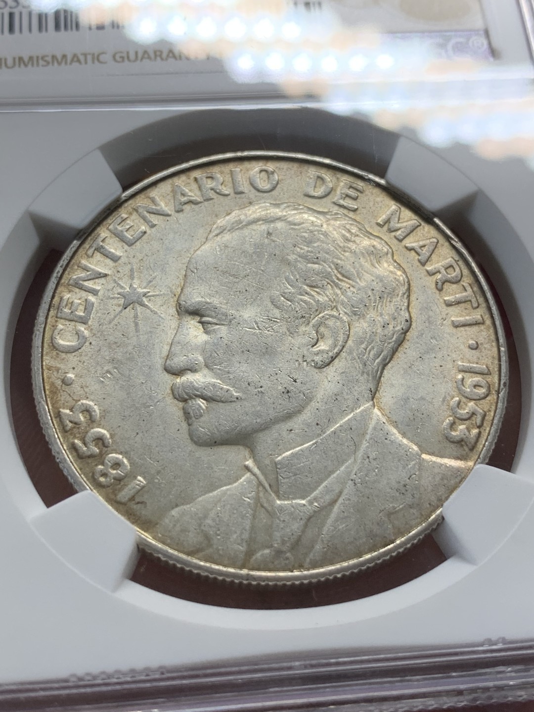 《竞宝斋》第91场-本周日，周一2场连拍（全场不限金额包邮） NGC-MS62 古巴1953年 何塞马丁百年纪念 1比索大银币 这币一般都是满脸麻子 能出分不容易