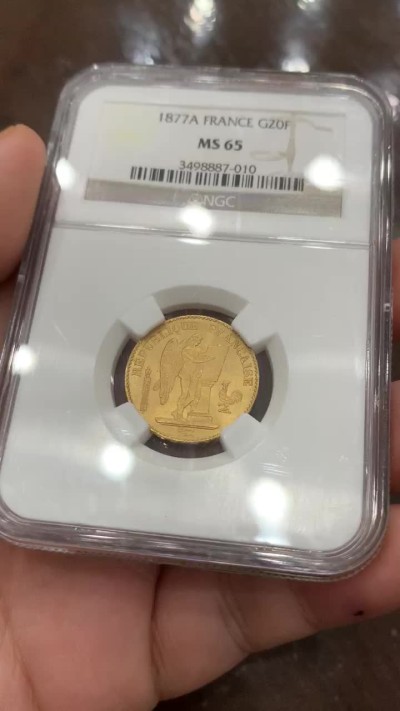 《竞宝斋》第91场-本周日，周一2场连拍（全场不限金额包邮） NGC MS65 法国1877年宪法天使20法郎幸运金币高分少见