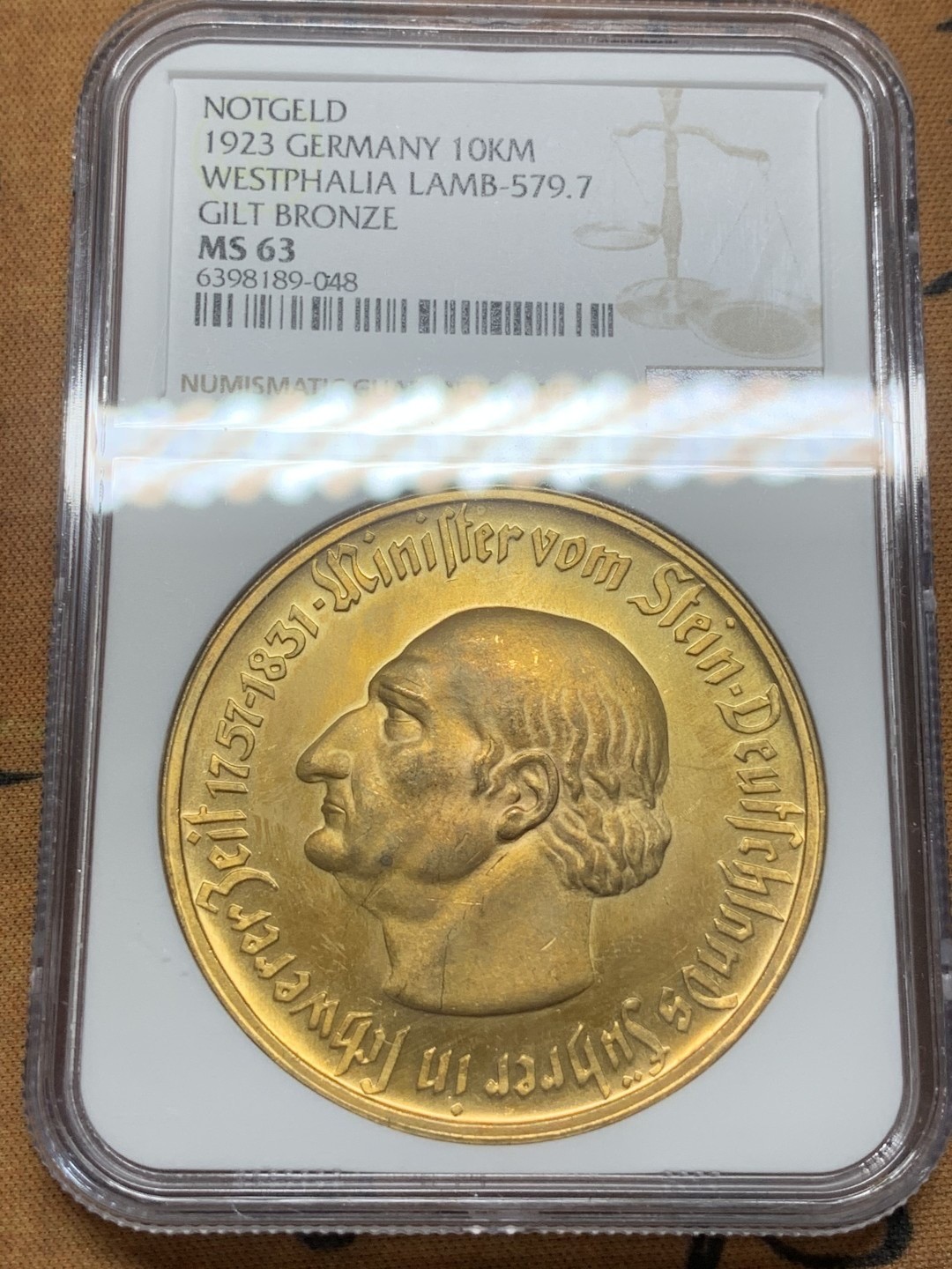 德国1923德紧铜镀金10000马克，NGC63分，状态请仔细核对官网图，十实物状态非常好 ，包邮非偏远。不议价！