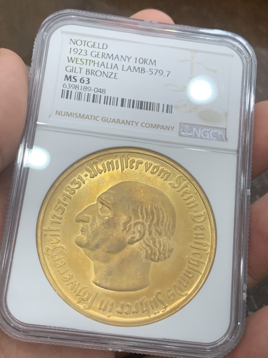 德国1923德紧铜镀金10000马克，NGC63分，状态请仔细核对官网图，十实物状态非常好 ，包邮非偏远。不议价！