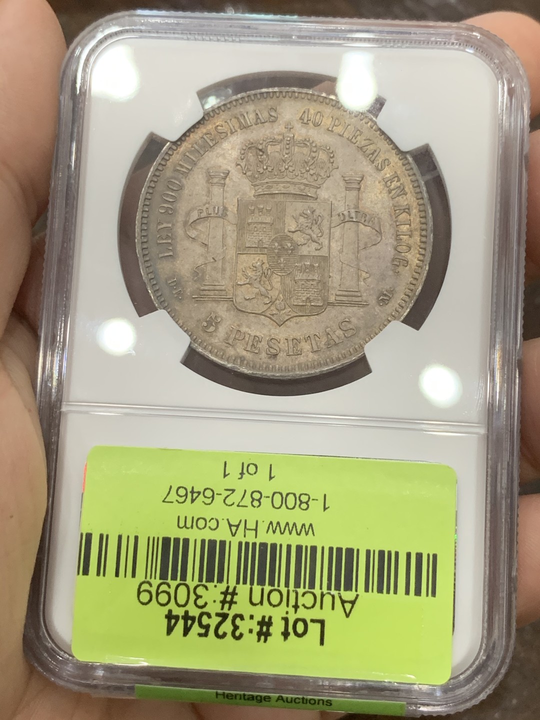 《竞宝斋》第95场-本周日，周一，周四，3场连拍（全场不限金额包邮） 冠军分！NGC MS65 1876西班牙阿方索十二世5比赛塔银币 三版头像中最少见的一版，只发行了两年，且背面纹章也是独一无二的存在，缺少了阿拉贡王国和纳瓦拉王国的纹章，取而代之的是城堡与狮子 同样头像的一枚NGC MS64+在HA拍出了5500美金的价格。