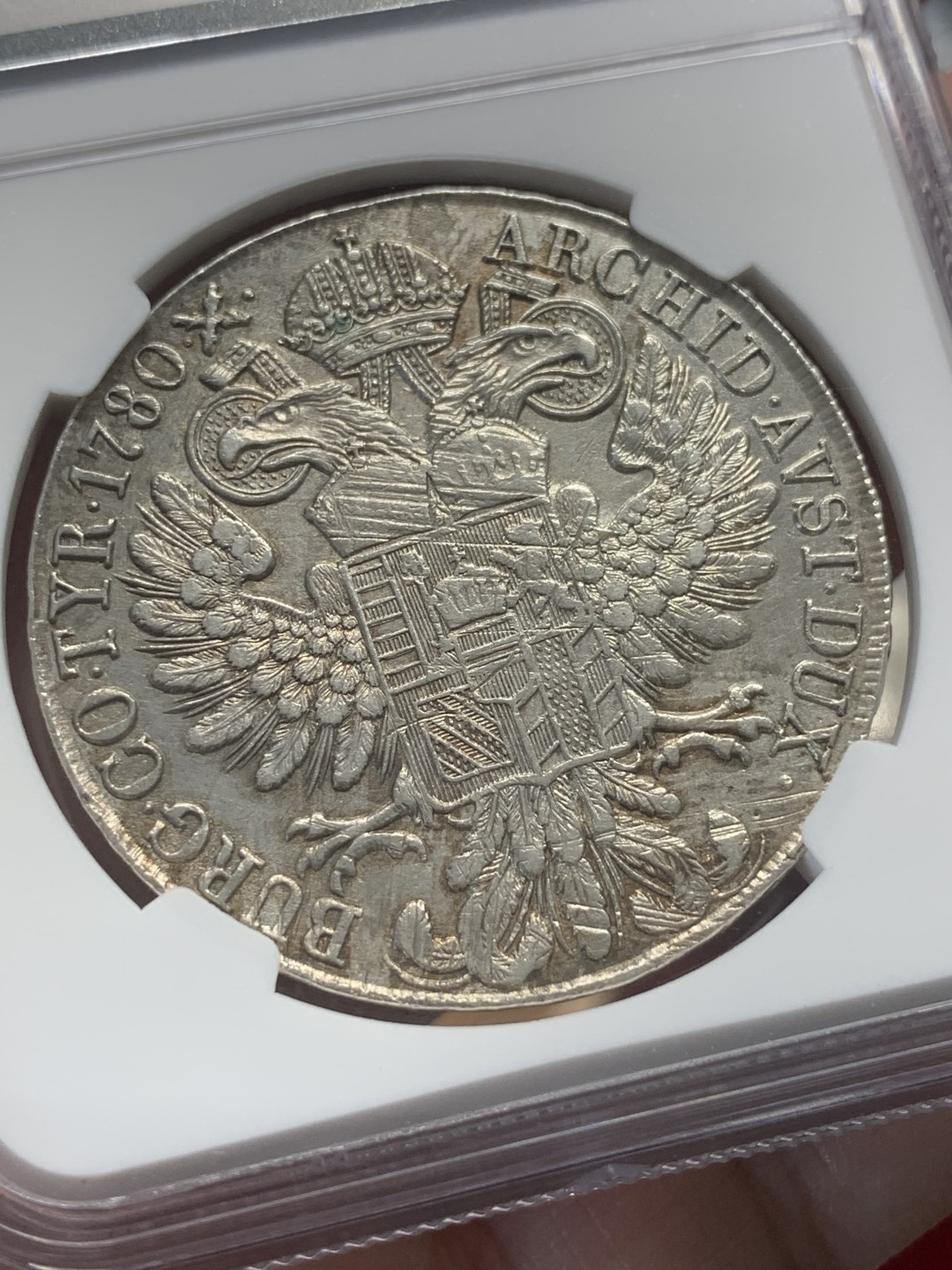 《竞宝斋》第95场-本周日，周一，周四，3场连拍（全场不限金额包邮） NGC-AUD 奥地利“1780年”特蕾莎1泰勒银币 1815-1830年铸造 对应目录编号应该是36a