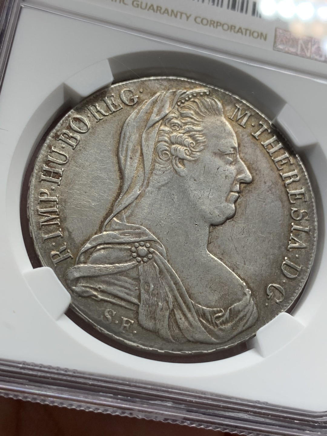 《竞宝斋》第95场-本周日，周一，周四，3场连拍（全场不限金额包邮） NGC-AUD 奥地利“1780年”特蕾莎1泰勒银币 1815-1830年铸造 对应目录编号应该是36a