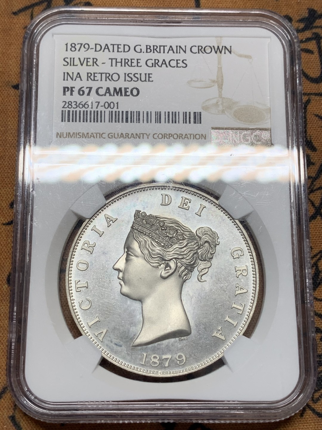 《竞宝斋》第95场-本周日，周一，周四，3场连拍（全场不限金额包邮） NGC-PF67CA 英国 1879年(2000) 维多利亚fantasy银币 克朗型 美惠三女神图案 铸造精美 KM-X81 HA2021年420美元成交