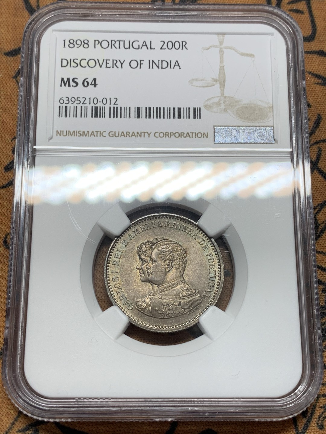 《竞宝斋》第95场-本周日，周一，周四，3场连拍（全场不限金额包邮） NGC-MS64 葡萄牙1898年 双人头军装版 200R银币 顶级的分数和味道 少见