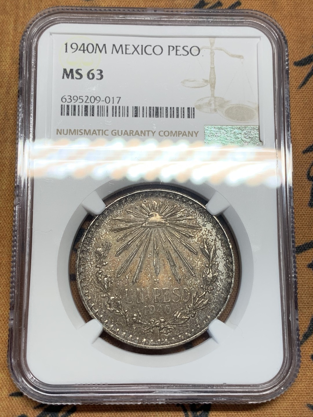 《竞宝斋》第95场-本周日，周一，周四，3场连拍（全场不限金额包邮） NGC-MS63 墨西哥1940年 五彩鹰洋 1比索 银币 这样的包浆能给分真的是太难了