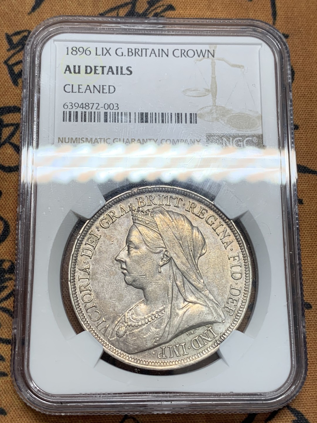 《竞宝斋》第95场-本周日，周一，周四，3场连拍（全场不限金额包邮） NGC-AU  英国 1896年LIX版 1克朗 马剑银币  ESC批纱马剑里面稀缺度最高的版本（R级别）附ESC 纪录