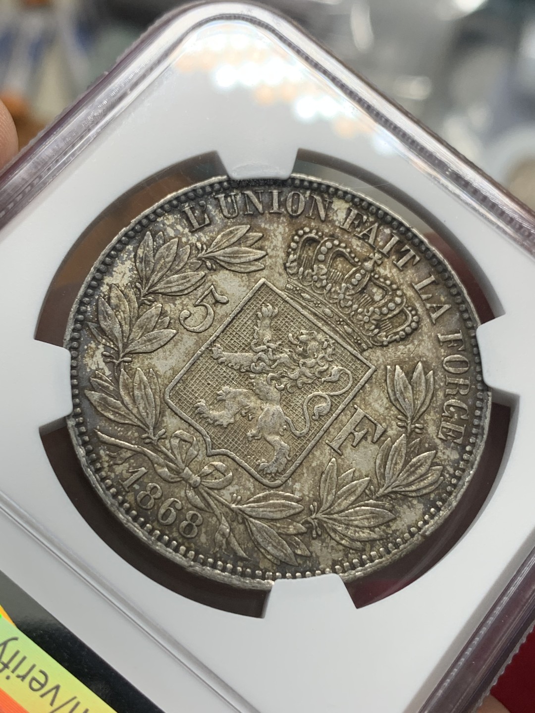 《竞宝斋》第95场-本周日，周一，周四，3场连拍（全场不限金额包邮） NGC-MS61 比利时1868年 利奥波德二世小头版 5法郎 浓烈的酱彩包浆能出分真的是非常难得 而且还是好版