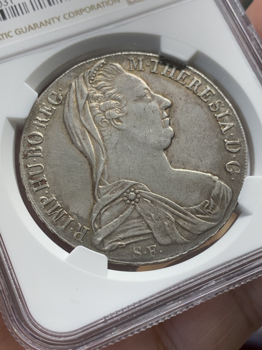 《竞宝斋》第95场-本周日，周一，周四，3场连拍（全场不限金额包邮） NGC-AUD 奥地利“1780年”特蕾莎1泰勒银币 1815-1830年铸造 对应目录编号应该是36a