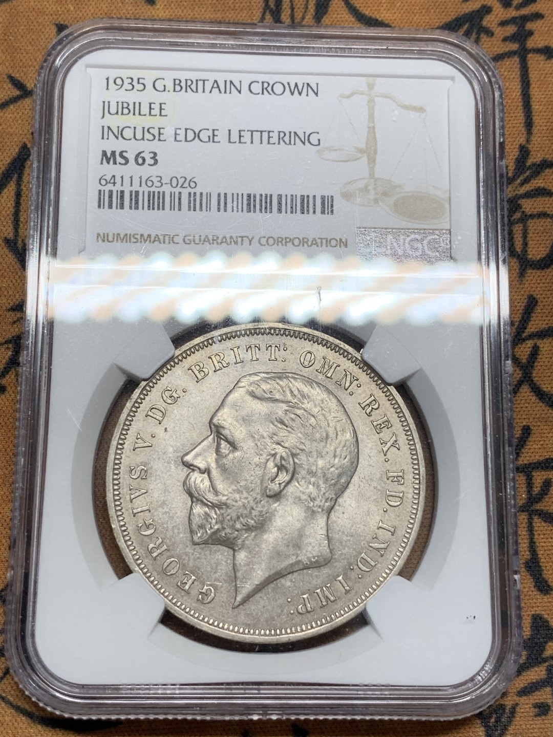 《竞宝斋》第96场-本周日，周一，周四，3场连拍（全场不限金额包邮） NGC-MS63 英国1935年乔治五世头像木马剑1克朗银币