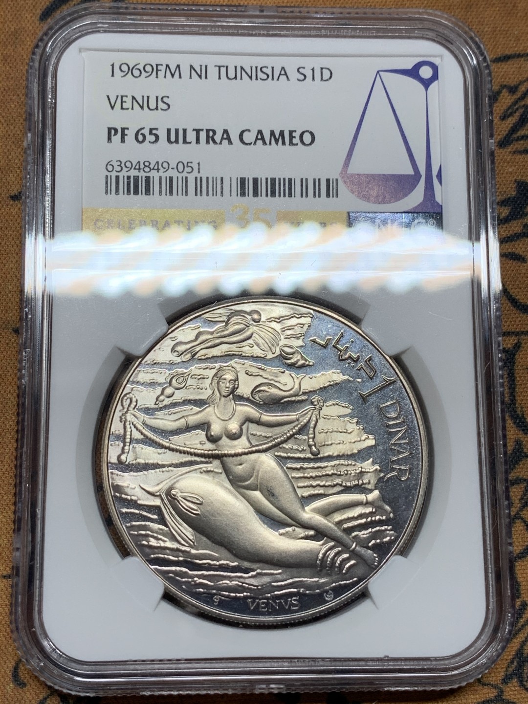《竞宝斋》第98场-本周日，周一2场连拍（全场不限金额包邮） NGC PF65UC 突尼斯1969年维纳斯裸女玩大肠（腓尼基文化系列）银币，经典品种！好品，35周年标签
