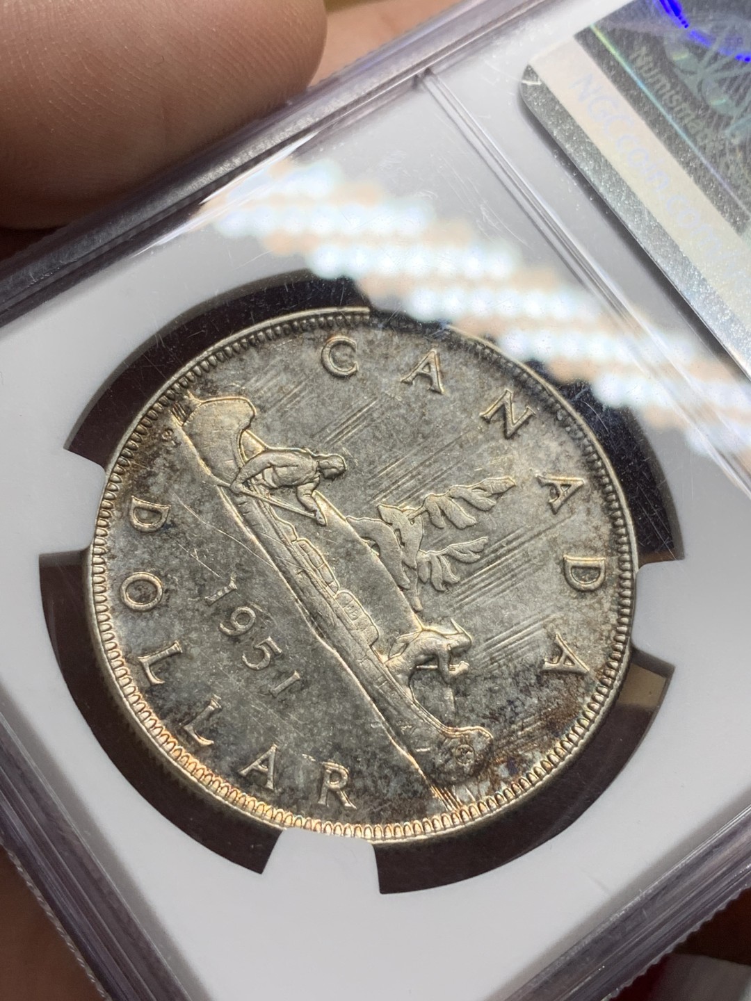 《竞宝斋》第98场-本周日，周一2场连拍（全场不限金额包邮） NGC-MS62 加拿大 1951年经典划船银币 1元银币 淡彩包浆 