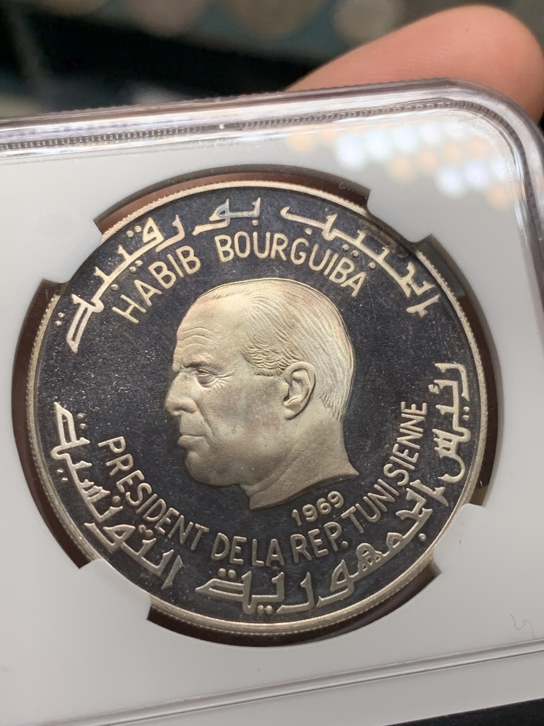 《竞宝斋》第98场-本周日，周一2场连拍（全场不限金额包邮） NGC PF65UC 突尼斯1969年维纳斯裸女玩大肠（腓尼基文化系列）银币，经典品种！好品，35周年标签