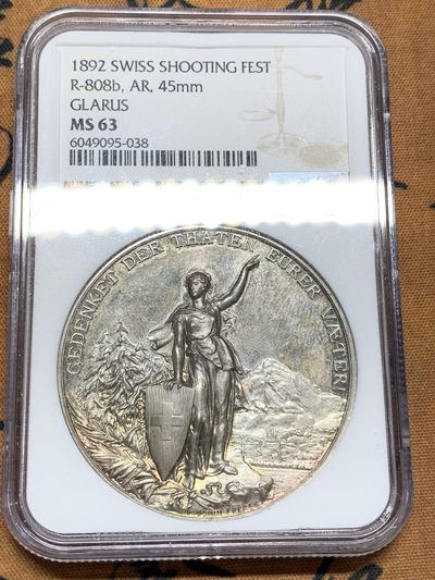 《竞宝斋》第99场-本周日，周一2场连拍（全场不限金额包邮） - NGC-MS63 1892 瑞士 格拉鲁斯 大规格 深浮雕射击节 银章PL 五彩底板