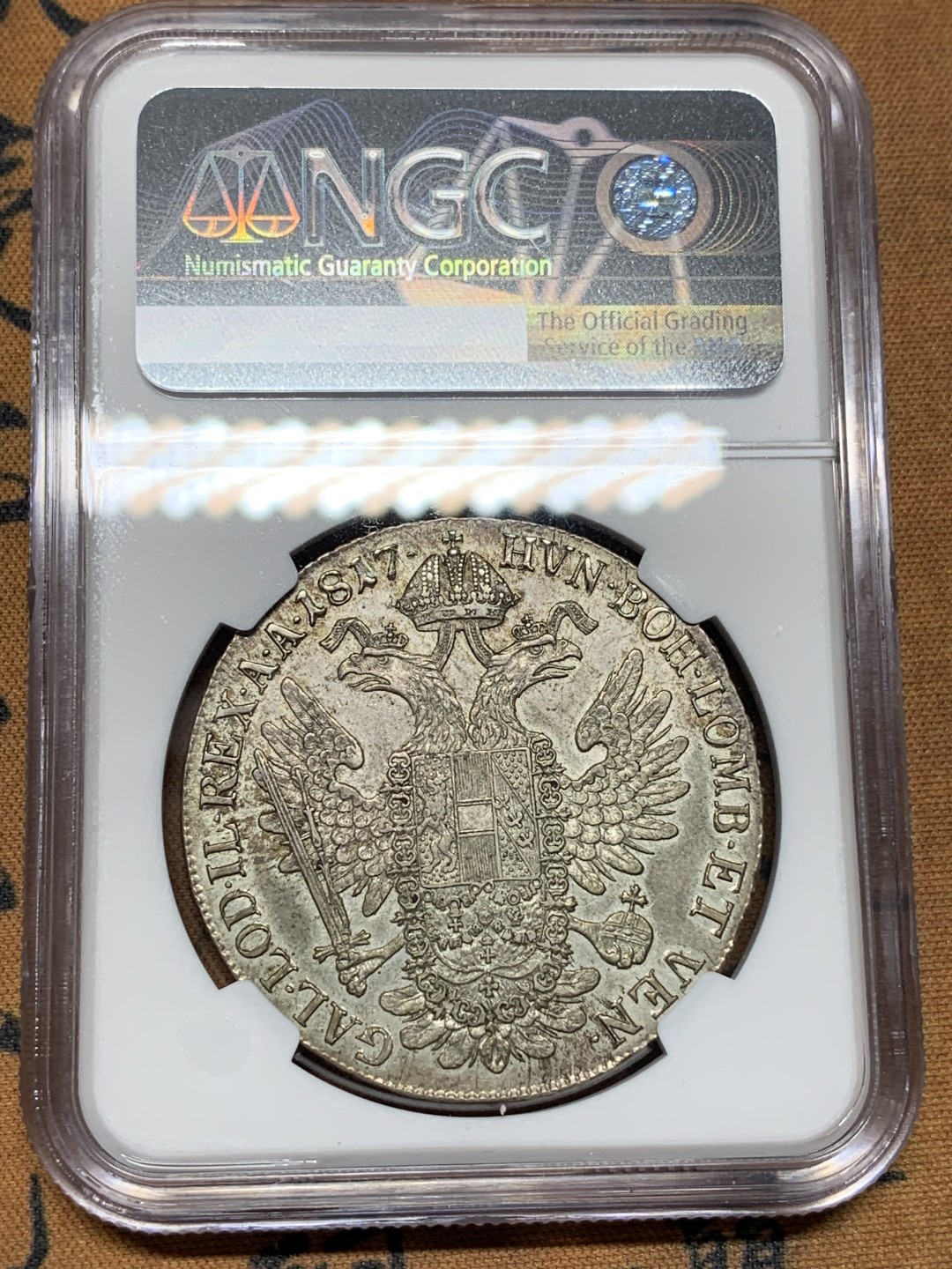 《竞宝斋》第100场-纪念拍卖 (全场包邮)中拍得限量纪念章 唯一冠军分 NGC AU58 奥地利 1817A 哈布斯堡王朝  泰勒银币 发髻清晰 卷发 波浪自然 鹰面底板也很好 包浆自然