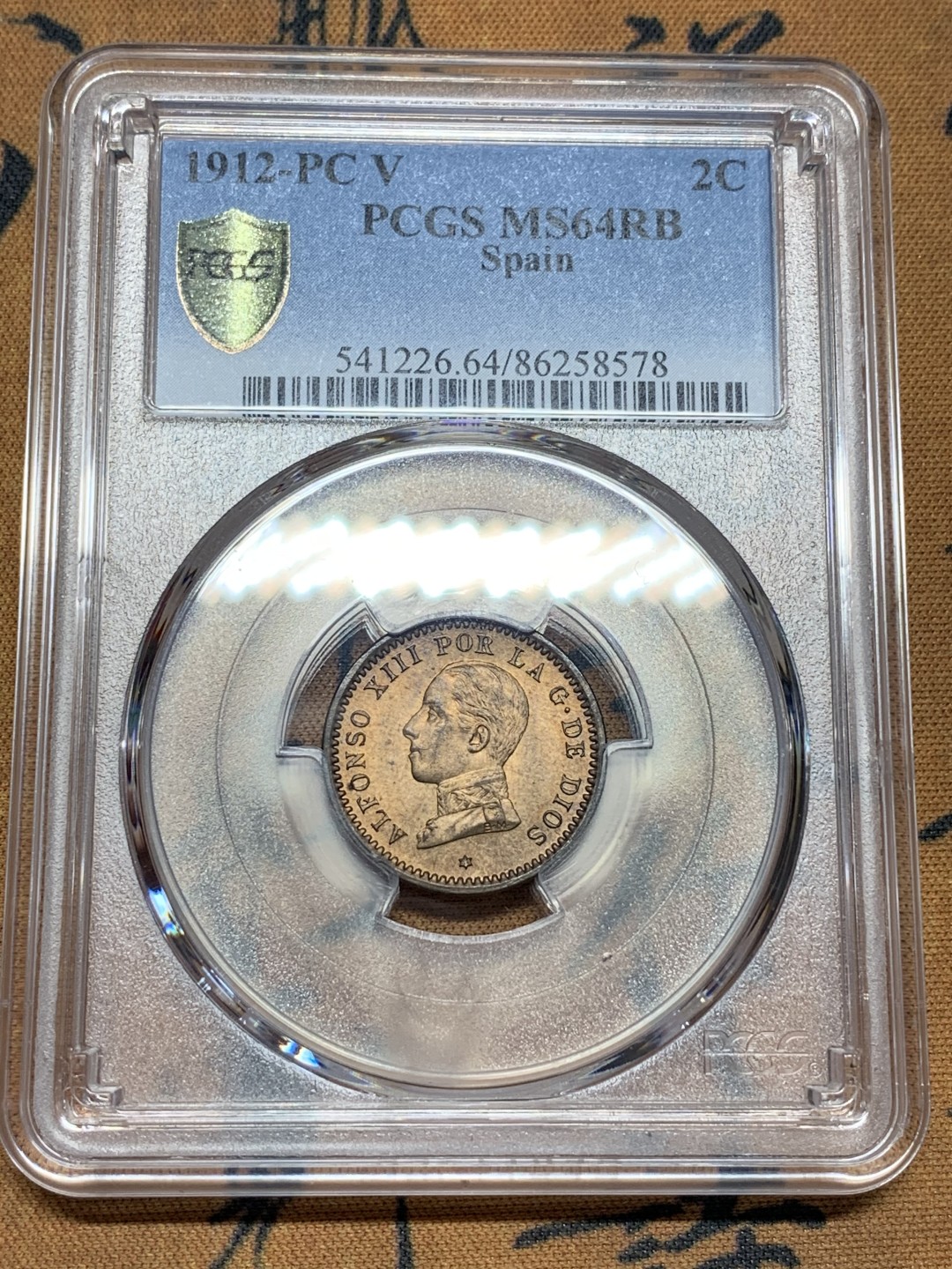 《竞宝斋》第100场-纪念拍卖 (全场包邮)中拍得限量纪念章 PCGS MS64RB 西班牙 1912年 阿方索十三世 2C 铜币 这个头像的高分不多 早年自己送评的 评级费就150了