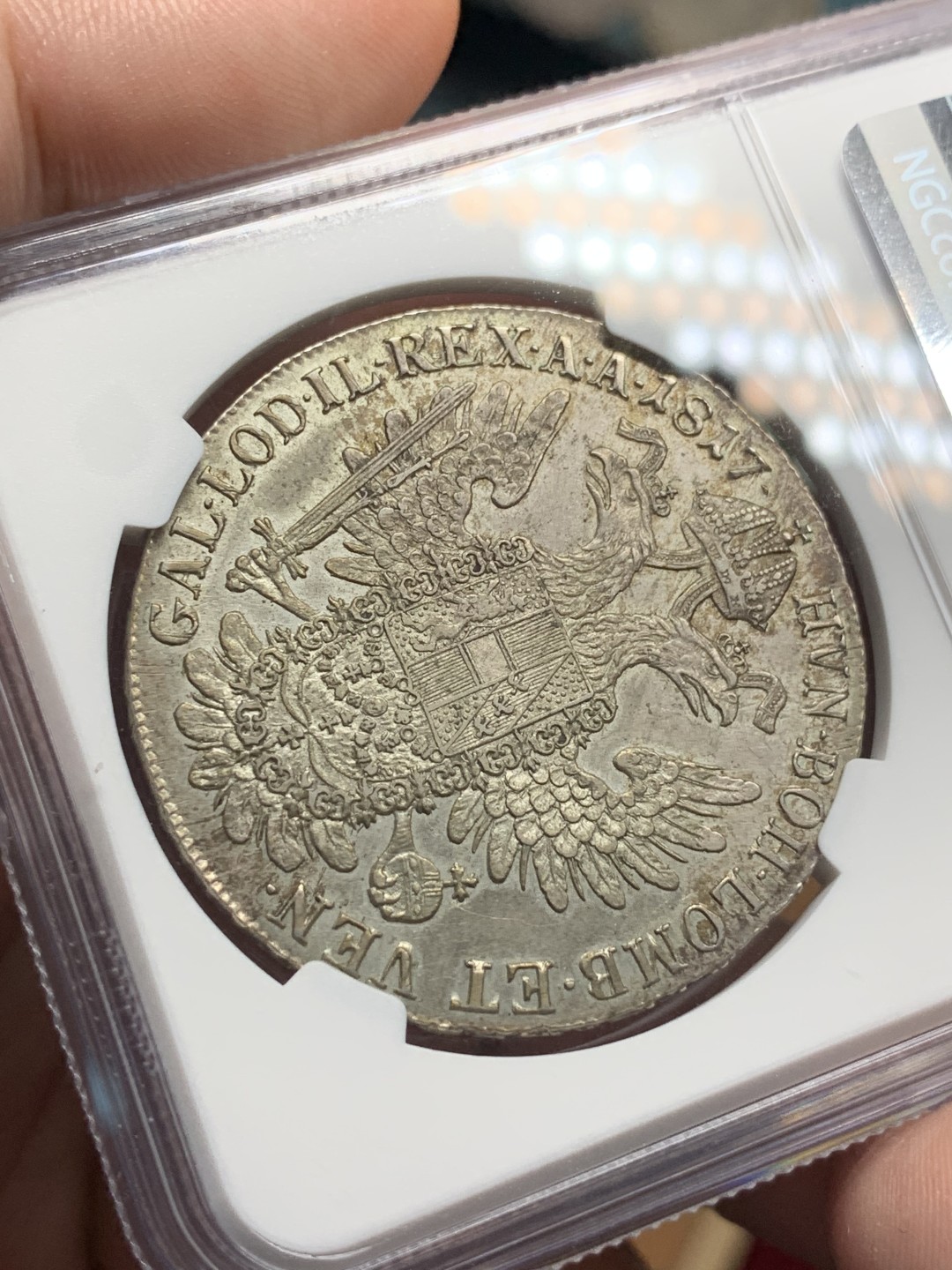 《竞宝斋》第100场-纪念拍卖 (全场包邮)中拍得限量纪念章 唯一冠军分 NGC AU58 奥地利 1817A 哈布斯堡王朝  泰勒银币 发髻清晰 卷发 波浪自然 鹰面底板也很好 包浆自然