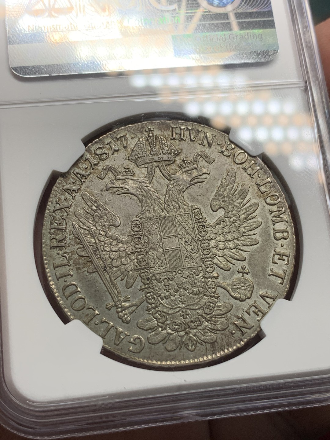 《竞宝斋》第100场-纪念拍卖 (全场包邮)中拍得限量纪念章 唯一冠军分 NGC AU58 奥地利 1817A 哈布斯堡王朝  泰勒银币 发髻清晰 卷发 波浪自然 鹰面底板也很好 包浆自然