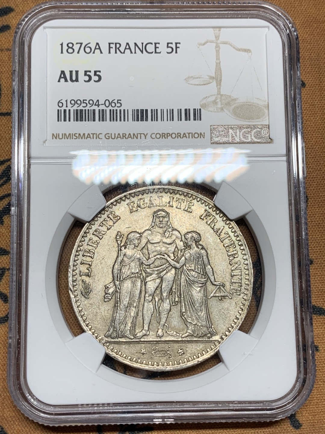 《竞宝斋》第100场-纪念拍卖 (全场包邮)中拍得限量纪念章 NGC AU55 法国 1876年 大力神5法郎银币 比较少的年份 状态不错