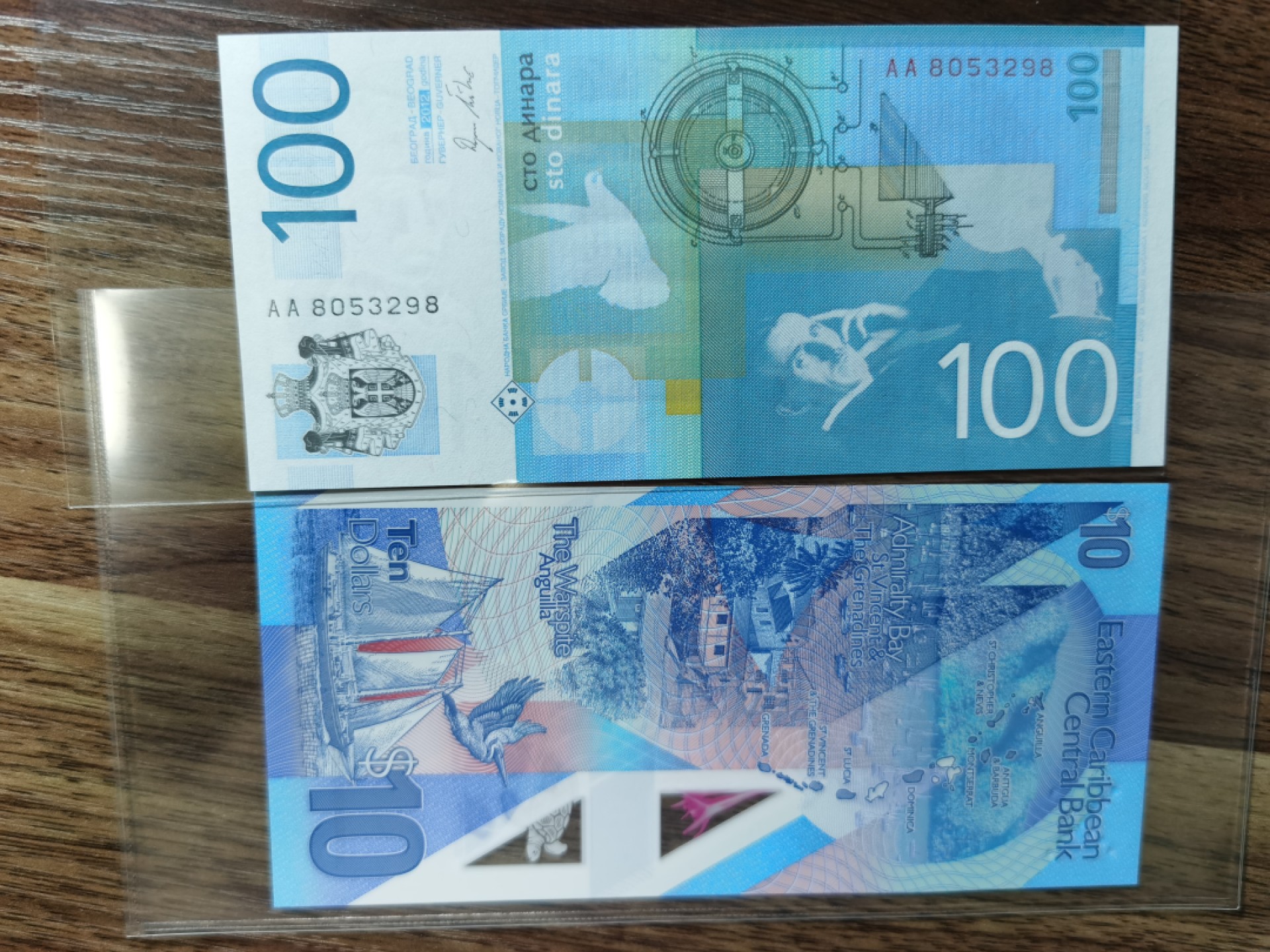 《张总收藏》75期——外币荟萃 东加勒比10元+塞尔维亚100第纳尔UNC,首发冠一对，东加勒比稀少首发GR冠千位号+塞尔维亚AA首发 特斯拉