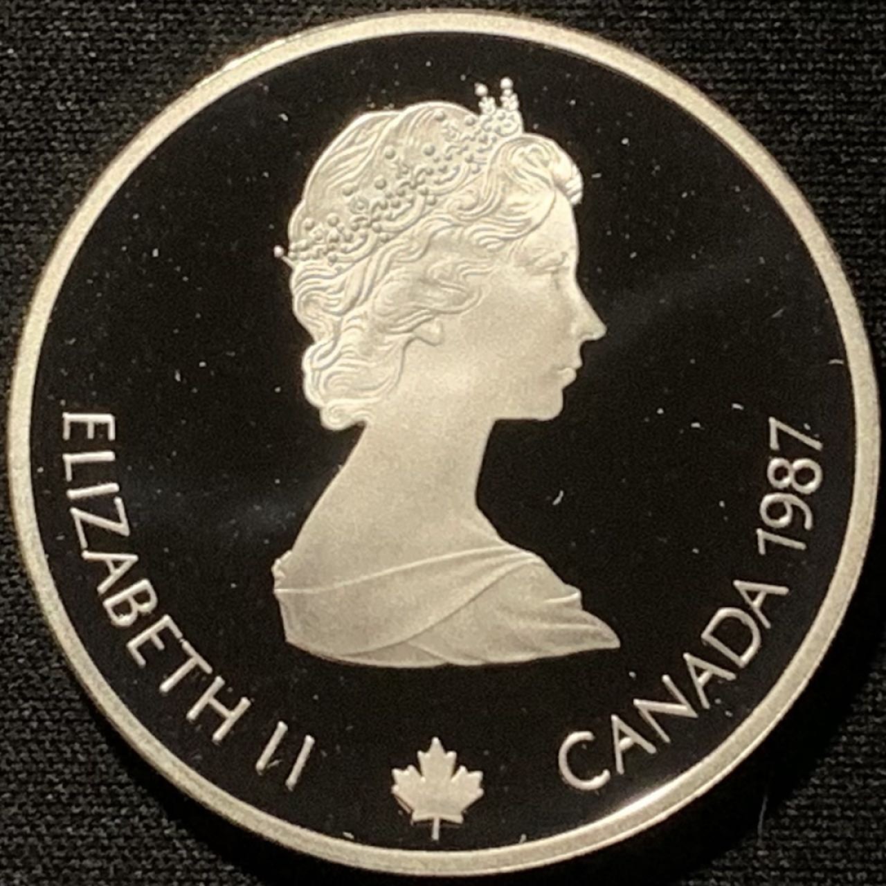 紫瑗钱币——第216期拍卖 加拿大 1987年 卡尔加里冬奥会 冰壶 20元 34.1克 0.925银 精制