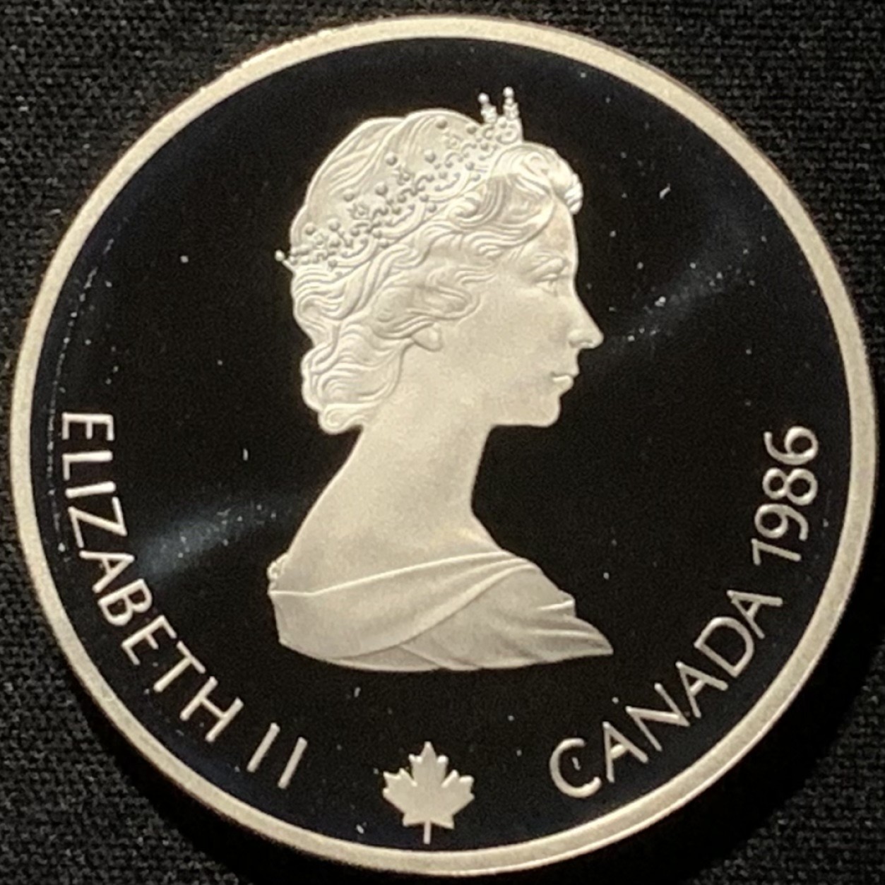 紫瑗钱币——第216期拍卖 加拿大 1986年 卡尔加里冬奥会 越野滑雪 20元 34.1克 0.925银 精制