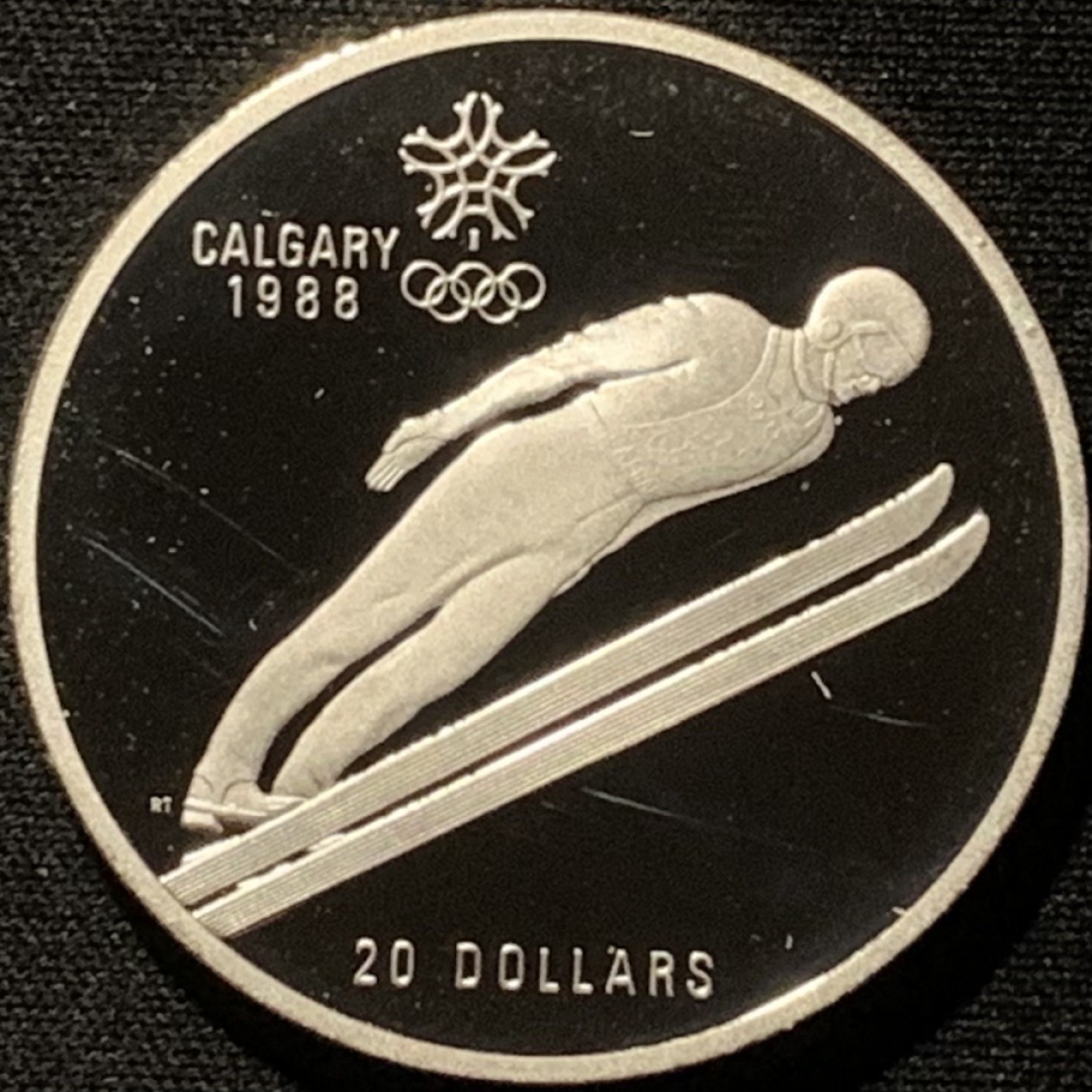 紫瑗钱币——第216期拍卖 加拿大 1987年 卡尔加里冬奥会 跳台滑雪 20元 34.1克 0.925银 精制