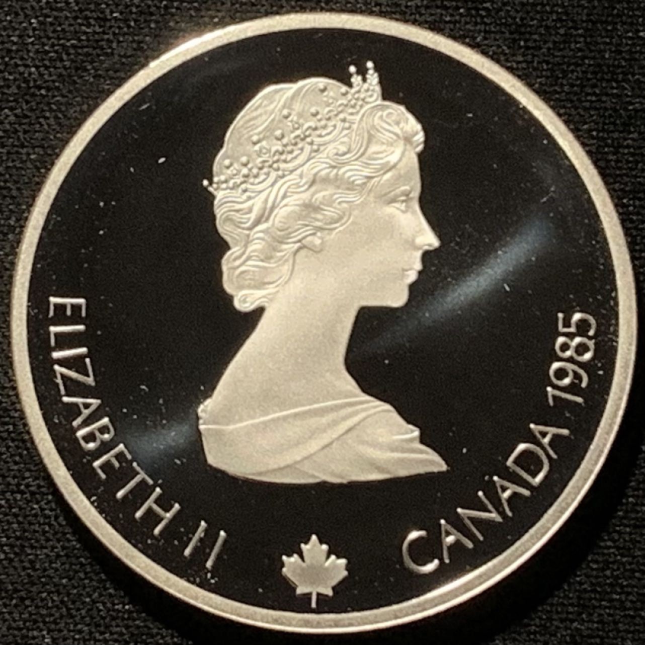 紫瑗钱币——第216期拍卖 加拿大 1985年 卡尔加里冬奥运 短道速滑 20元 银币 34.1克 0.925银 精制