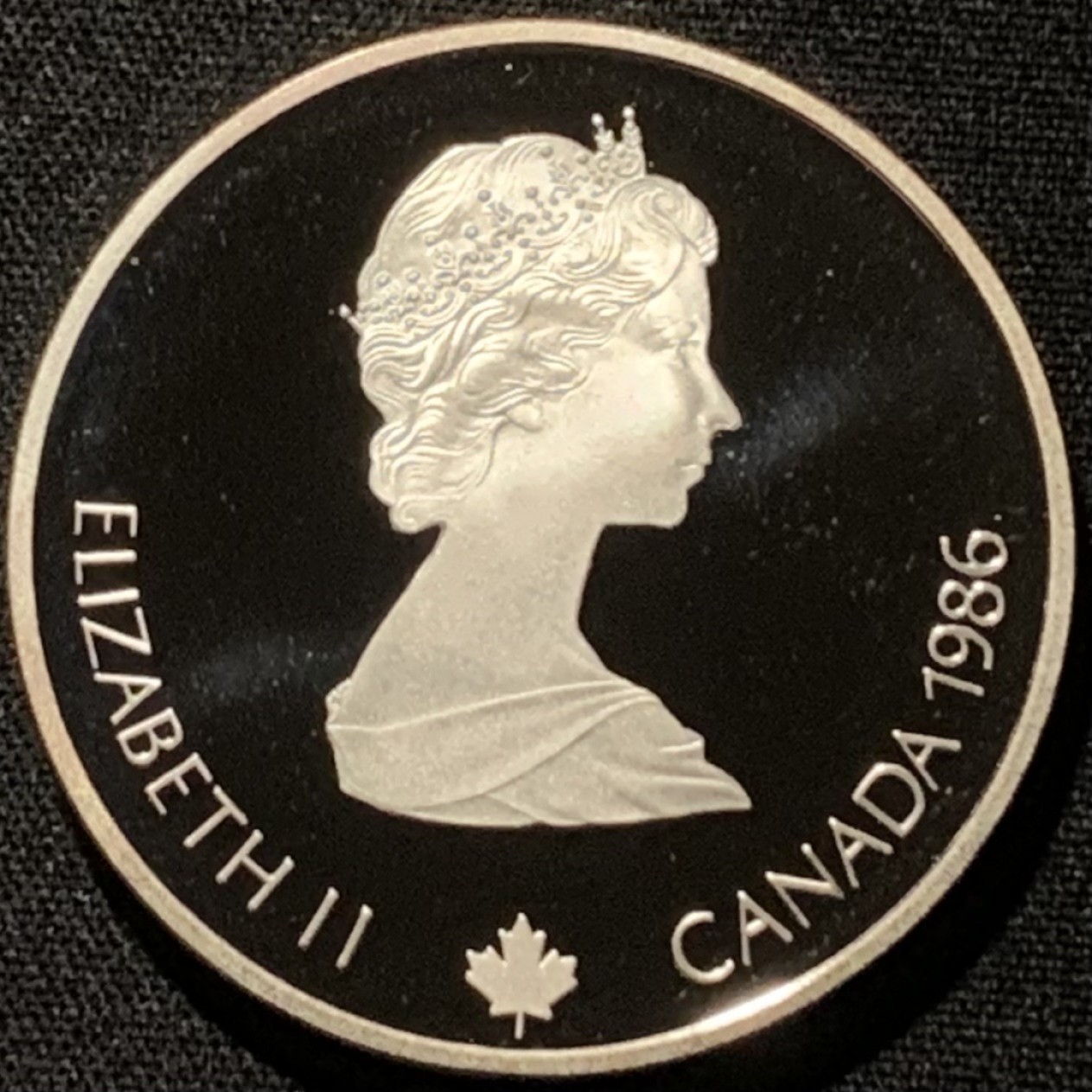 紫瑗钱币——第216期拍卖 加拿大 1986年 卡尔加里冬奥会 冰球 20元 34.1克 0.925银 精制