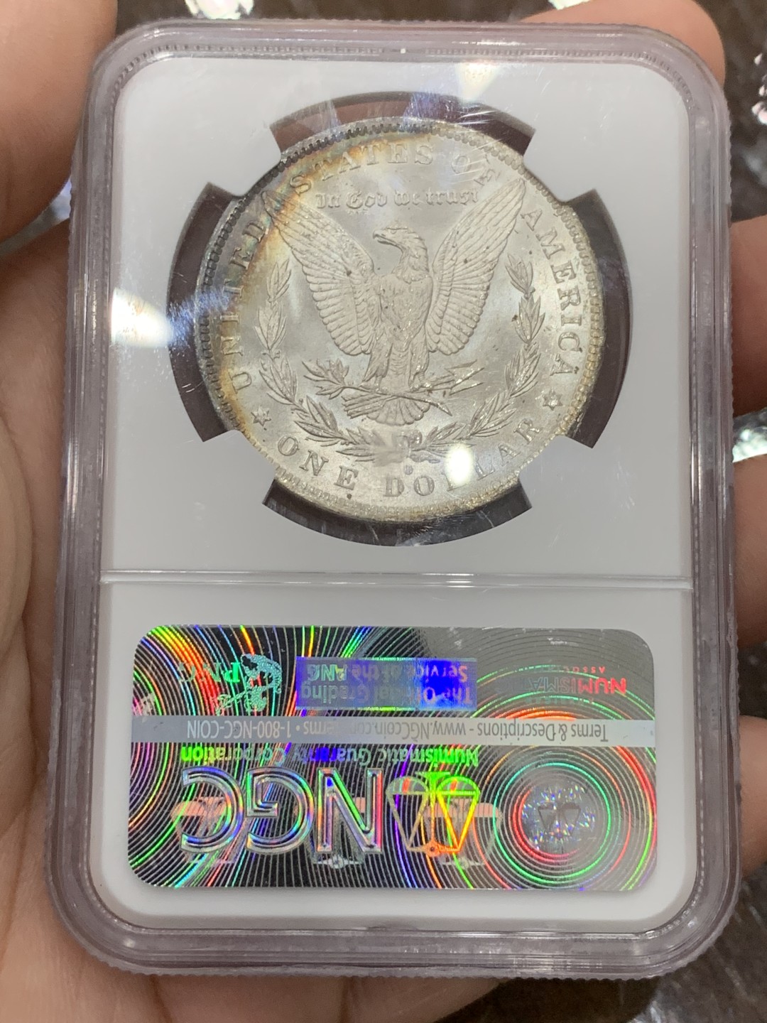 《竞宝斋》第106场-周日，周一 2场连拍（全场包邮） NGC-MS64 美国 1884年 摩根银币 女神面6点-10点 鹰面8点-1点均为rainbow七彩月牙 摩根最贵的彩种