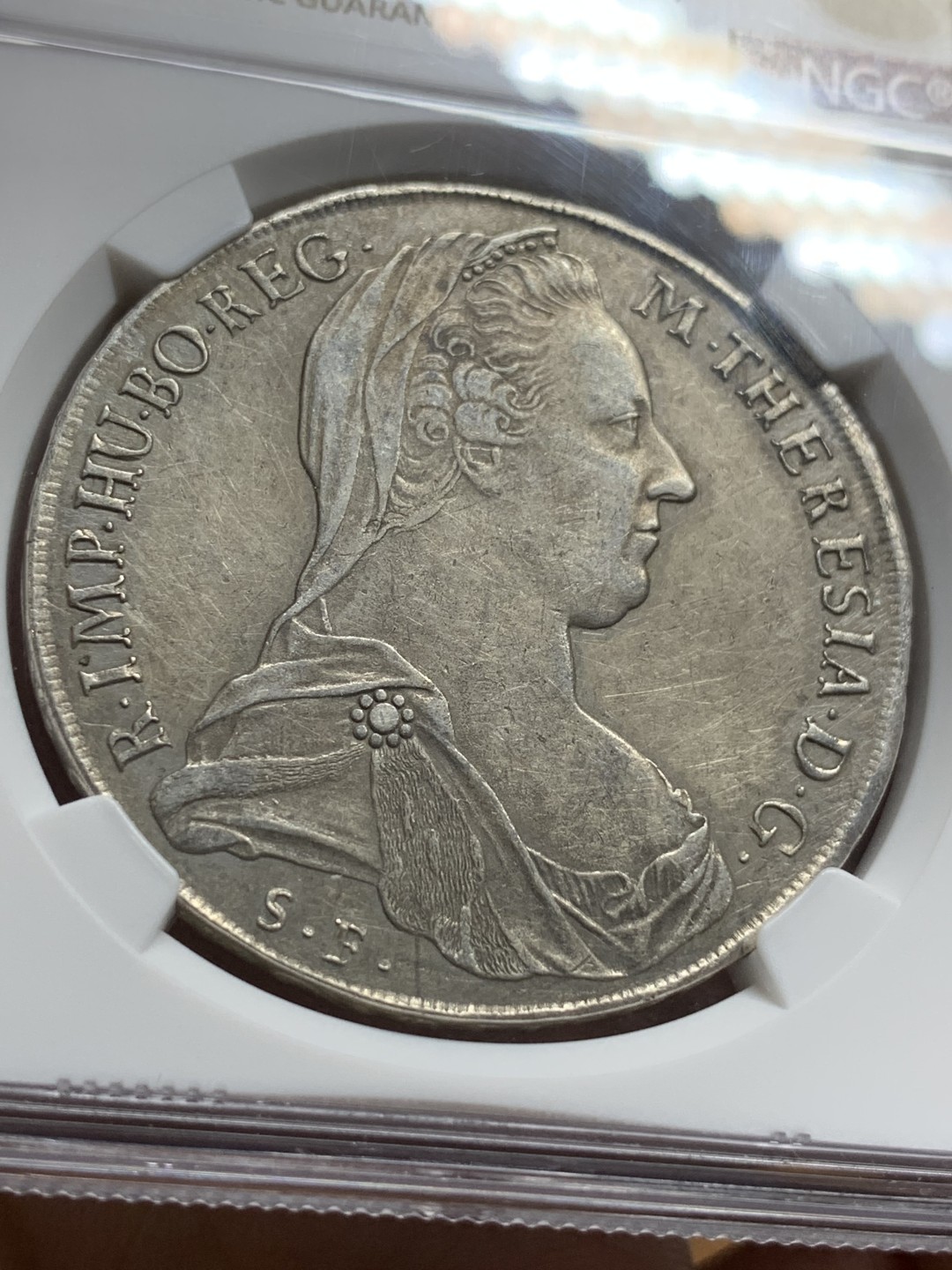 《竞宝斋》第106场-周日，周一 2场连拍（全场包邮） NGC-AUD 奥地利“1780年”特蕾莎1泰勒银币 1817-1833年铸造 威尼斯 对应目录编号应该是37a N就给了早期后铸要加强了