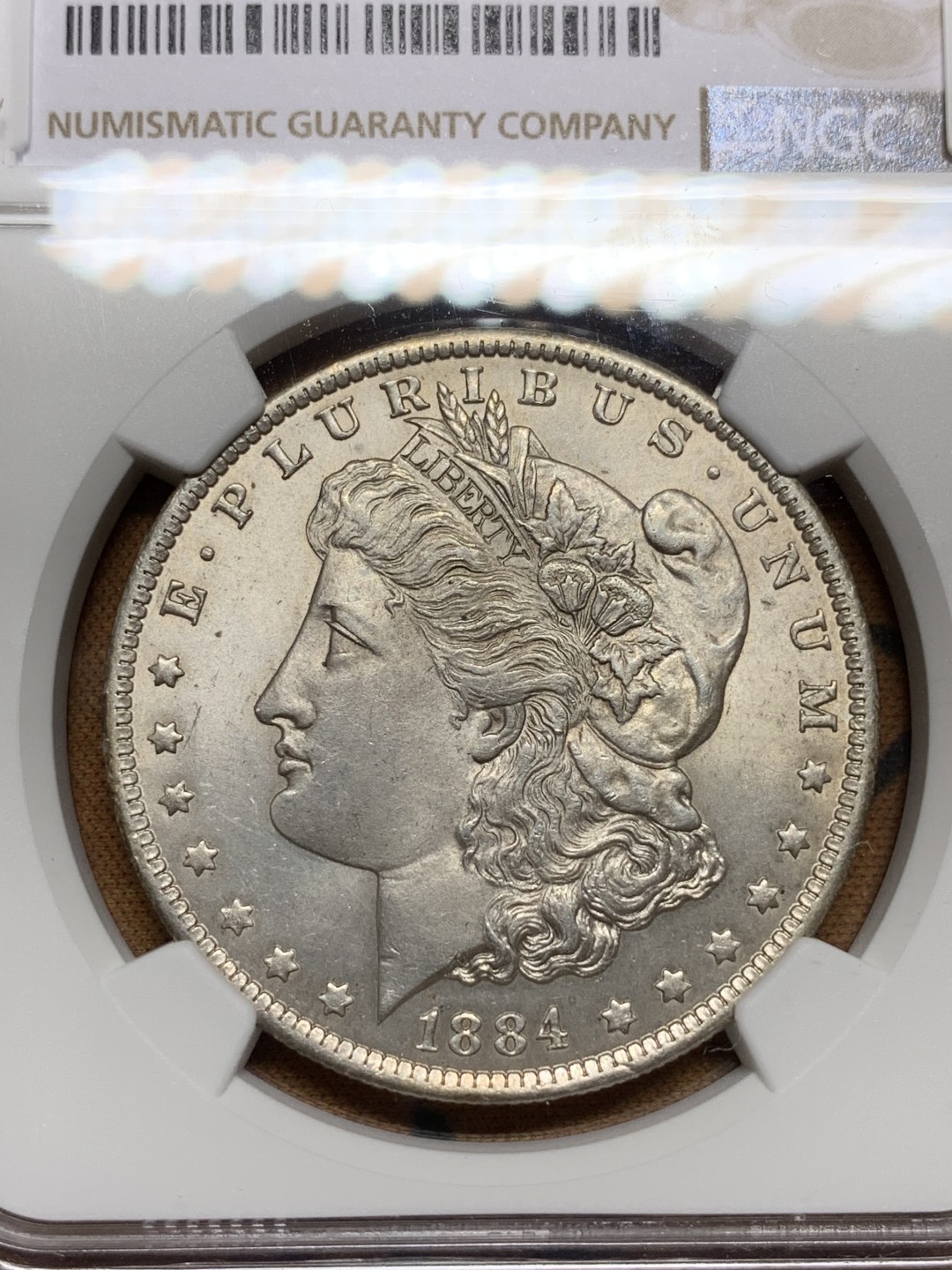 《竞宝斋》第106场-周日，周一 2场连拍（全场包邮） NGC-MS62 美国1884-O年 摩根一元银币 原光好品 较少的厂名