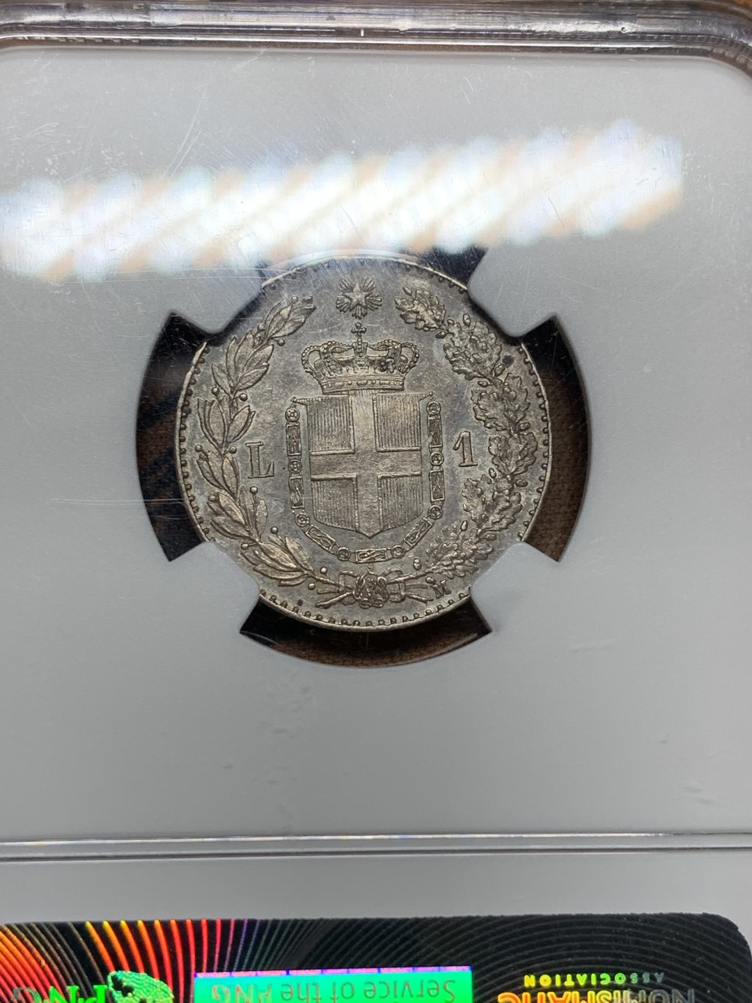 《竞宝斋》第106场-周日，周一 2场连拍（全场包邮） NGC MS62 意大利 1887年 翁贝托1里拉 银币 双面深五彩包浆 状态难得