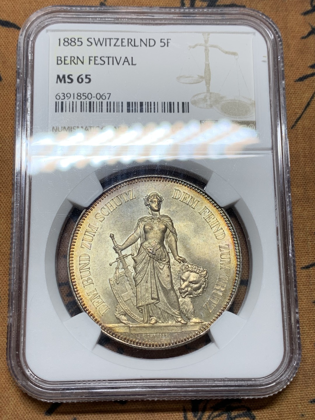 《竞宝斋》第106场-周日，周一 2场连拍（全场包邮） NGC-MS65 1885瑞士伯尔尼射击节5法郎银币 状态及其完美 正面金色包浆背面凝霜 外拍成交价已经很高了