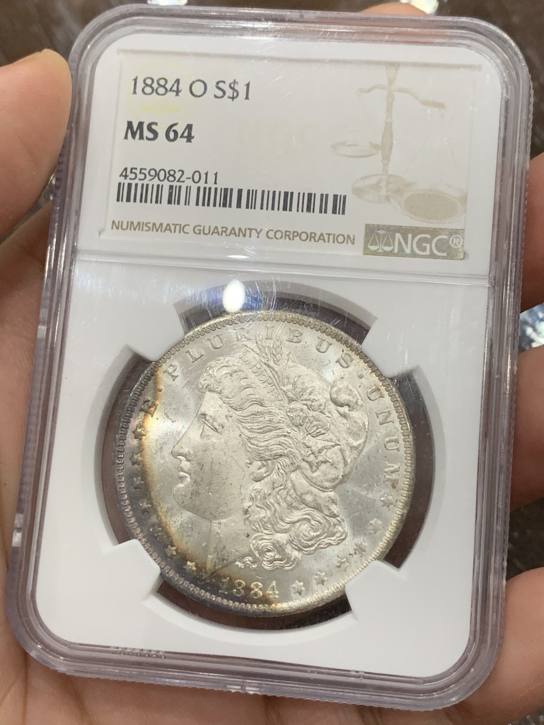 《竞宝斋》第106场-周日，周一 2场连拍（全场包邮） NGC-MS64 美国 1884年 摩根银币 女神面6点-10点 鹰面8点-1点均为rainbow七彩月牙 摩根最贵的彩种