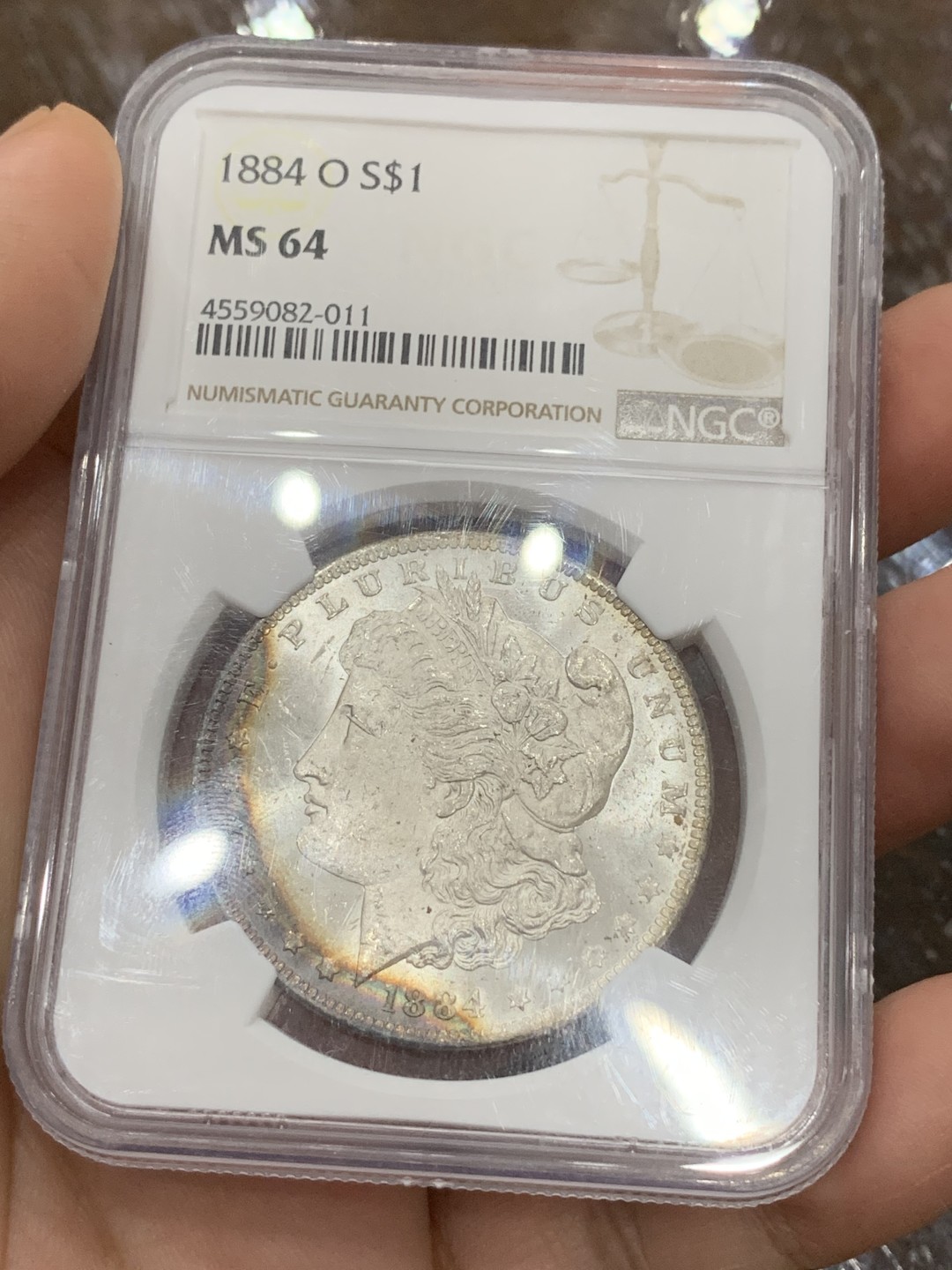 《竞宝斋》第106场-周日，周一 2场连拍（全场包邮） NGC-MS64 美国 1884年 摩根银币 女神面6点-10点 鹰面8点-1点均为rainbow七彩月牙 摩根最贵的彩种
