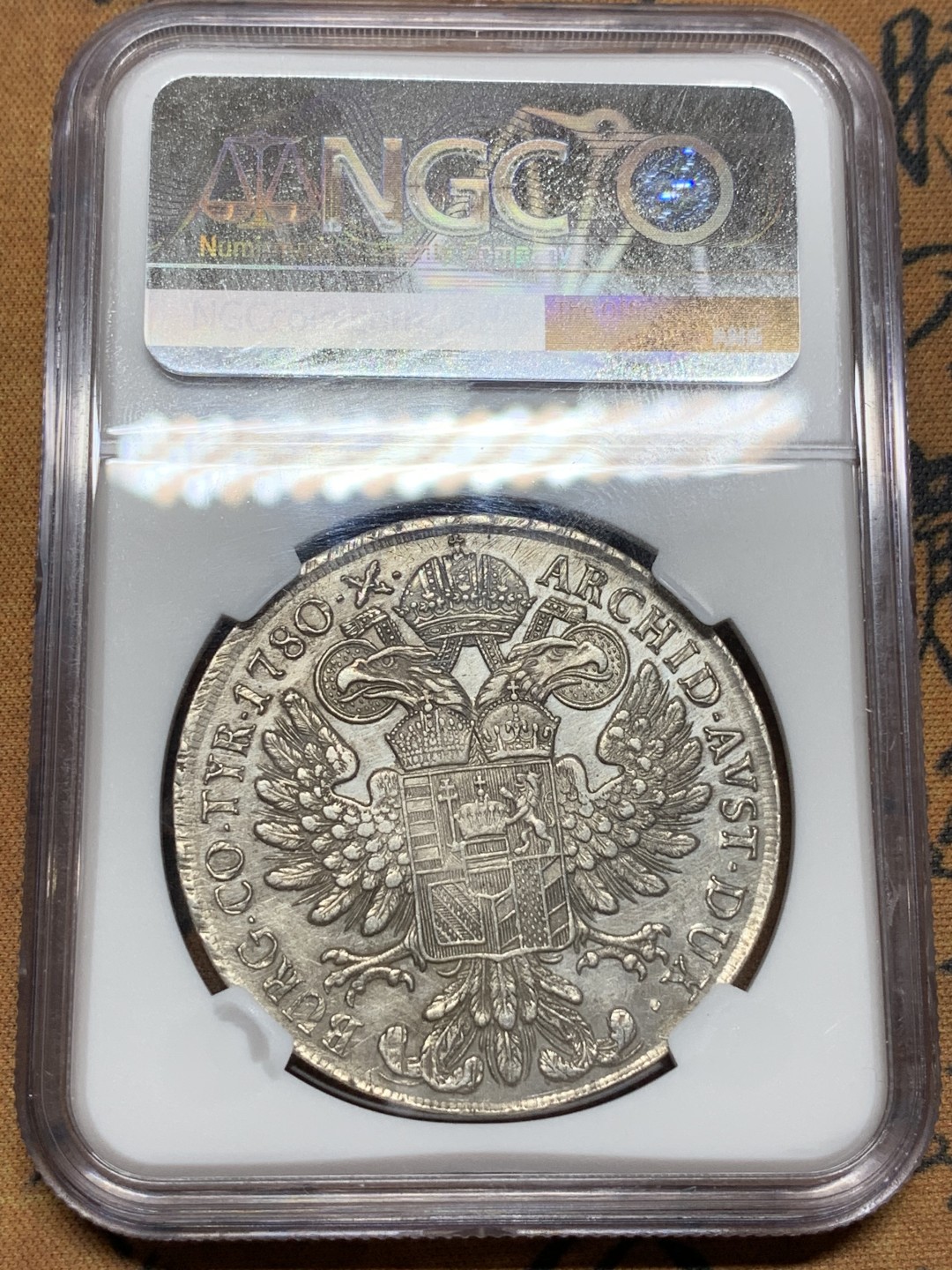 《竞宝斋》第106场-周日，周一 2场连拍（全场包邮） NGC-AUD 奥地利“1780年”特蕾莎1泰勒银币 1817-1833年铸造 威尼斯 对应目录编号应该是37a N就给了早期后铸要加强了