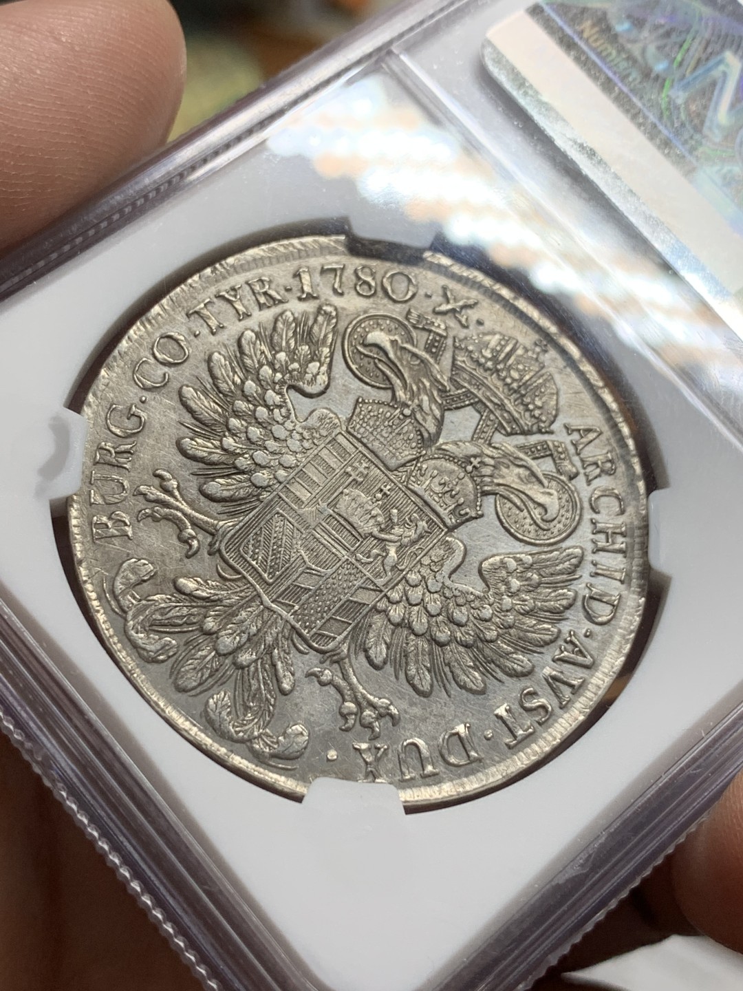 《竞宝斋》第106场-周日，周一 2场连拍（全场包邮） NGC-AUD 奥地利“1780年”特蕾莎1泰勒银币 1817-1833年铸造 威尼斯 对应目录编号应该是37a N就给了早期后铸要加强了