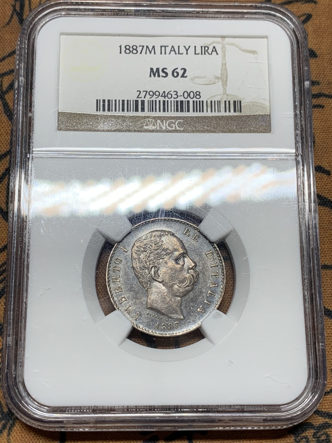 《竞宝斋》第106场-周日，周一 2场连拍（全场包邮） NGC MS62 意大利 1887年 翁贝托1里拉 银币 双面深五彩包浆 状态难得