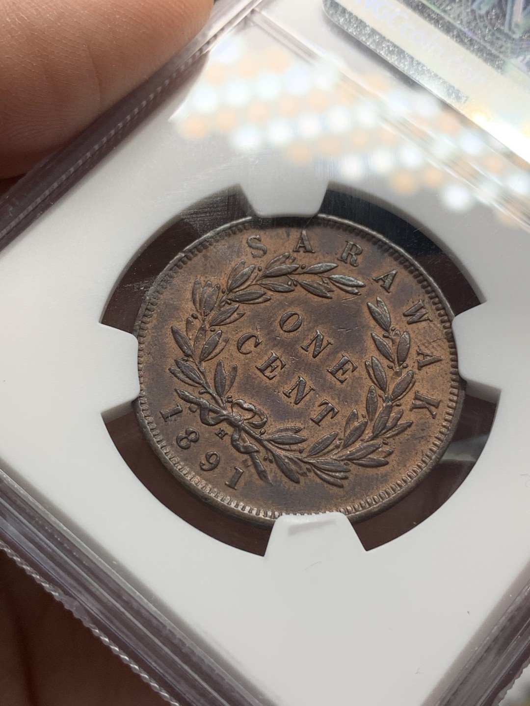 《竞宝斋》第107场-周日，周一 2场连拍（全场包邮） NGC AU58 BN 沙捞越1891年H 一分 铜币 自然细腻 五官发丝皆清晰