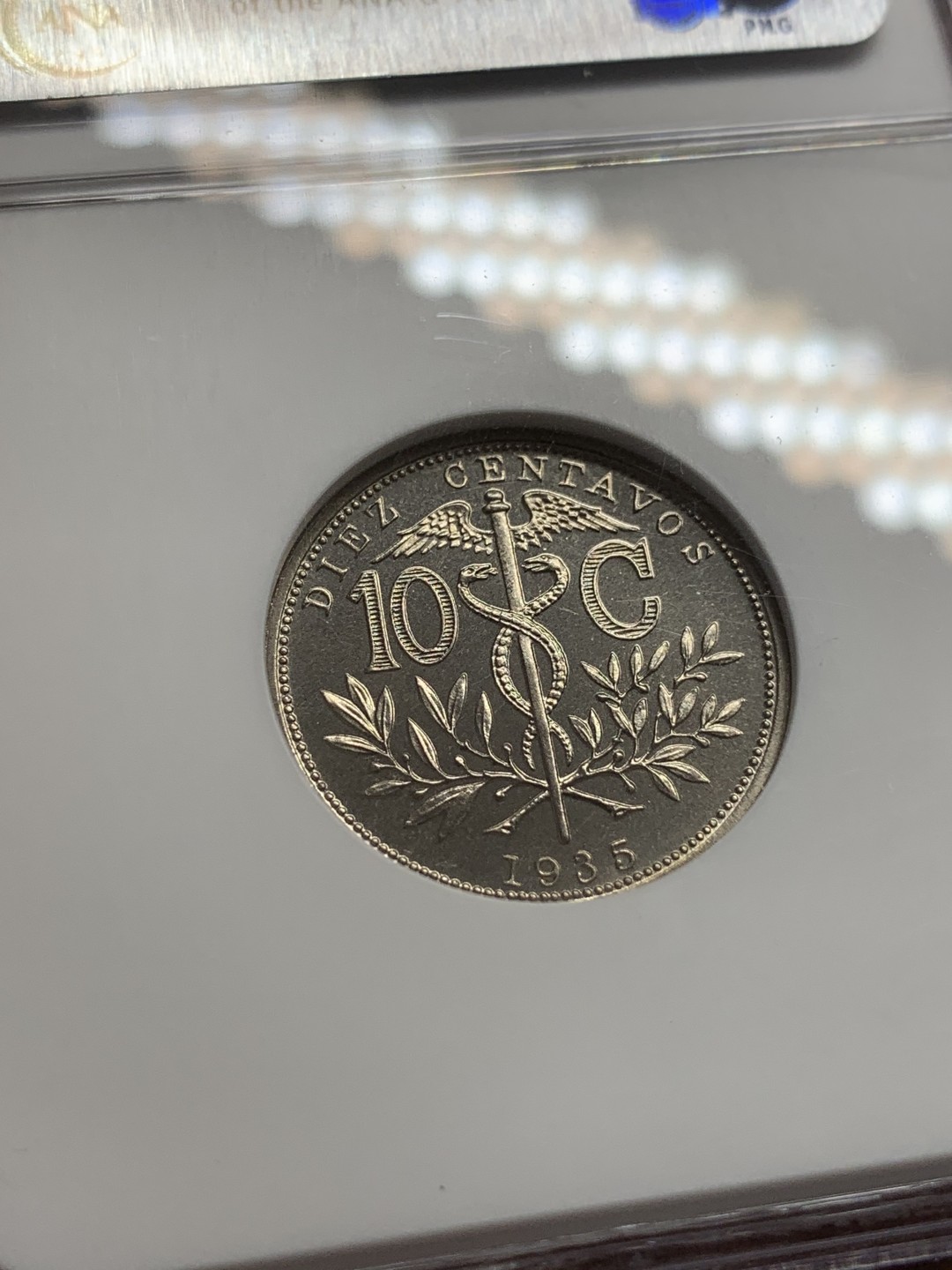 《竞宝斋》第108场-周日，周一 ，周四3场连拍（全场包邮） 1935年玻利维亚精制10分 PF66分，克书出谱品无记录，镜面感强烈，做工有别于流通币，NGC经典小白盒