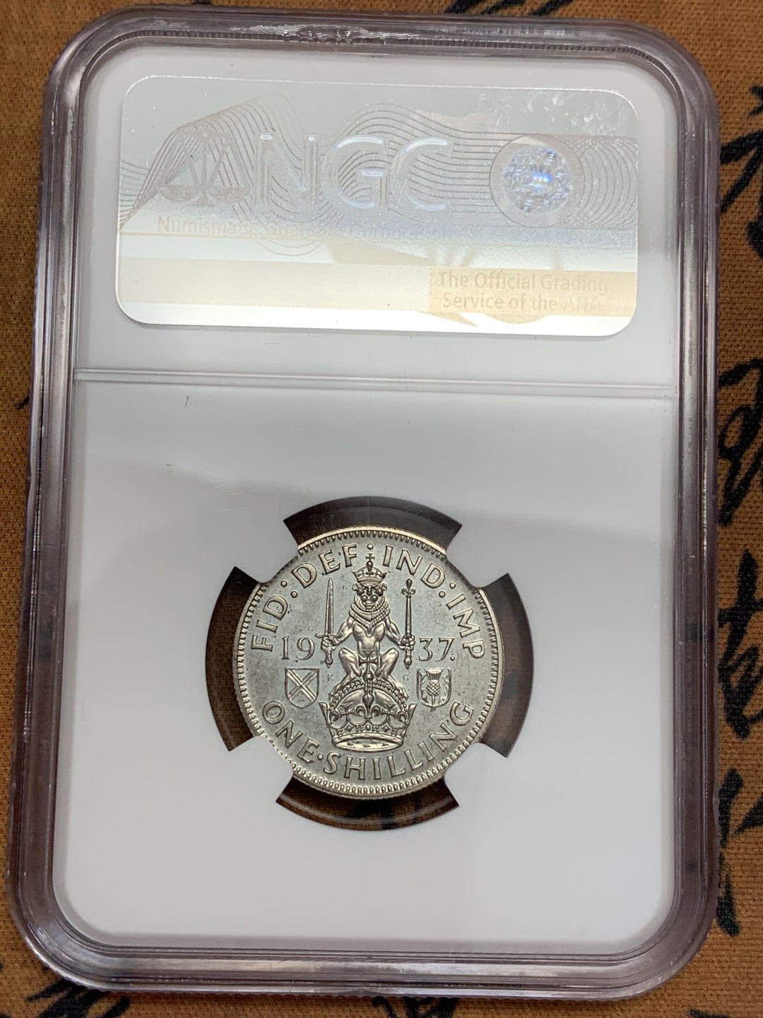 《竞宝斋》第108场-周日，周一 ，周四3场连拍（全场包邮） NGC-PF62  英国  1937  1先令  乔六登基 精制币 带包浆难得