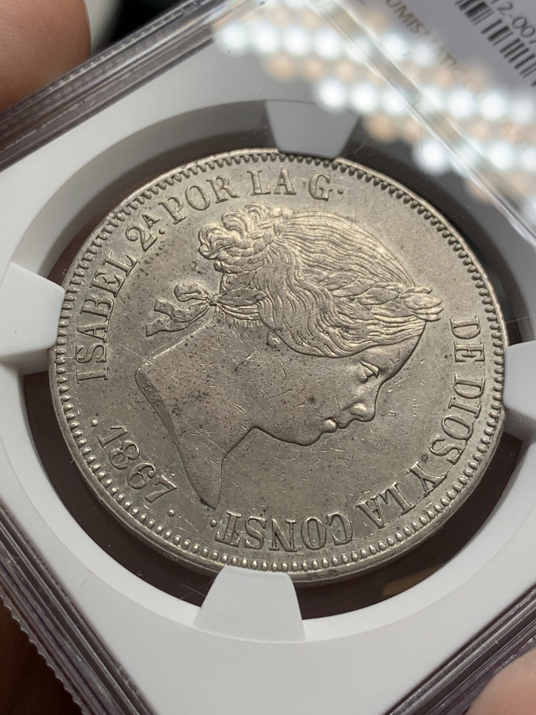 《竞宝斋》第109场-周日，周一 ，周四3场连拍（全场包邮） NGC AU55 西班牙1867年伊莎贝拉猪头妹2埃斯库多大银币，比20R面值少见