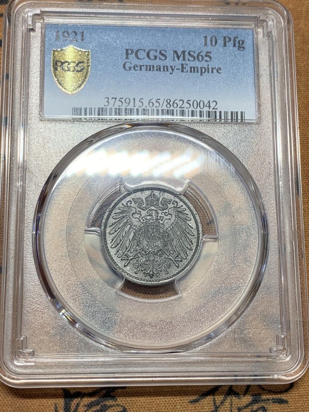 《竞宝斋》第109场-周日，周一 ，周四3场连拍（全场包邮） PCGS-MS65 德国 1921年 长翅 10芬尼锌币   保存不易