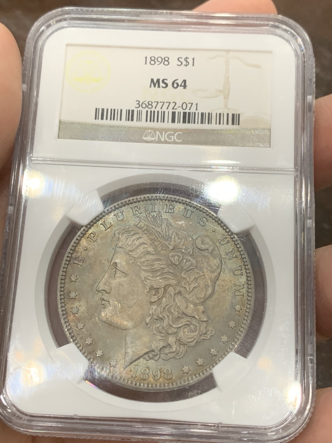 《竞宝斋》第109场-周日，周一 ，周四3场连拍（全场包邮） NGC-MS64 美国 1898年 摩根银币 疑似卷首币 女神面满灰彩 背淡金色环彩